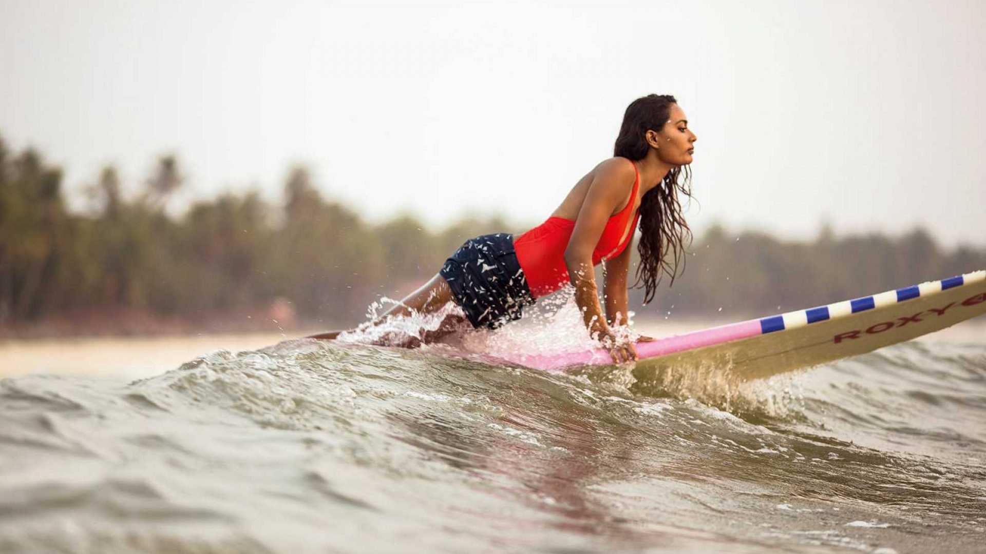 a-girl-having-fun-on-surfboard-min